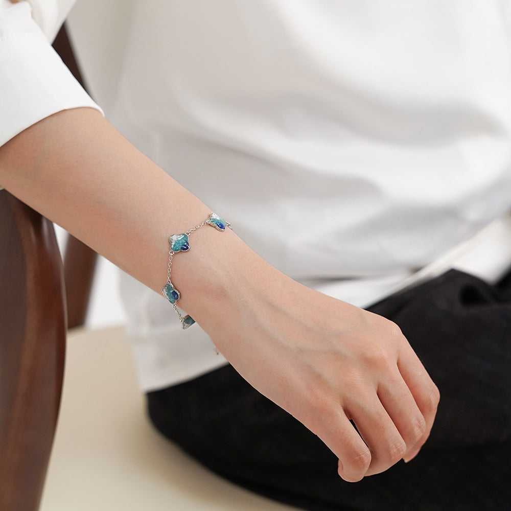 Silver Four-Leaf Clover Bracelet – Blue & White